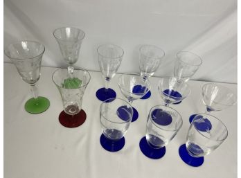 Collection Of Etched Glasses With Colorful Bases
