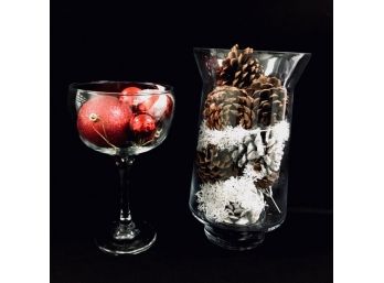 Two Tall Glass Vessels Filled W/ Pine Cone & Bulb Decor