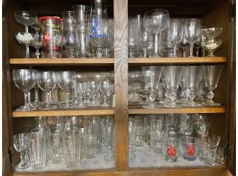 A Full Cabinet Of Glass Barware.
