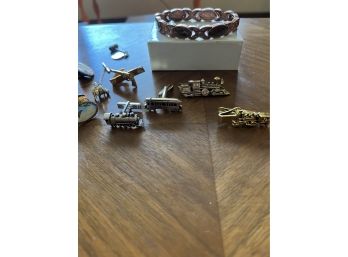 An Assortment Of Cuff Links And Bracelet