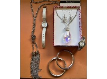 An Assortment Of Silver Tone & Crystal Jewelry