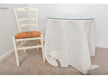 Minic White Round Table With Glass Top, DKNY Tablecloth And Ladderback Chair With Rush Seat