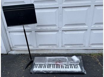 Casio LK-230 Lighted Personal Keyboard And Manhasset Music Stand