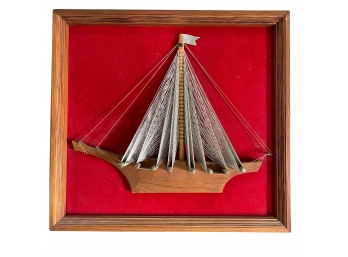 Vintage 3D Multimedia Wood And String Sailboat On Red Velvet Background