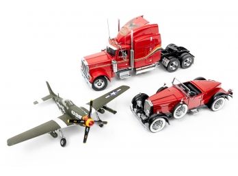 Franklin mint Peterbilt model 379 and 1928 Stutz-Black Hawk Boat tail speedster and Old grow Airplane