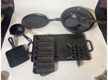 LOT OF ELEVEN WELL SEASONED CAST IRON PANS FROM VARIOUS MAKERS