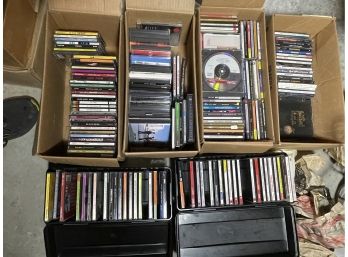 200 ROCK AND ROLL CDS IN ORIGINAL BOXES