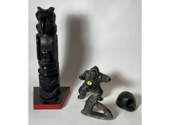 THREE INUIT STONE CARVINGS AND A WOOD TOTEM