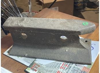 AN ANTIQUE IRON ANVIL