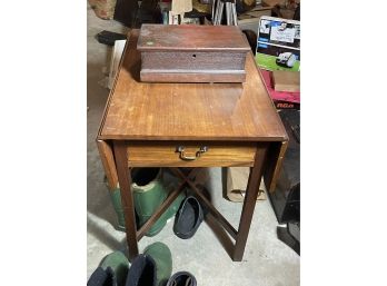 A MAHOGANY DROPLEAF TABLE AND AN ANTIQUE WALNUT SEWING BOX