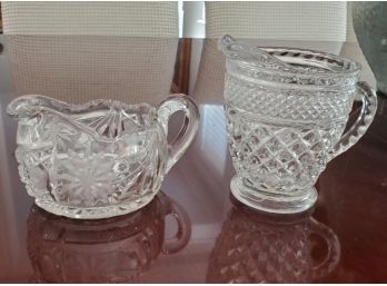 A Pair Of Pressed Glass Creamer Pitchers