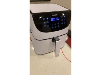 An Electric Air Fryer By Cosori