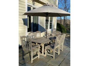 A Weathered  Smith & Hawken Teak Wood Table, Two Leaves, 8 Chairs By Wood Classic Plus White  Umbrella Stand