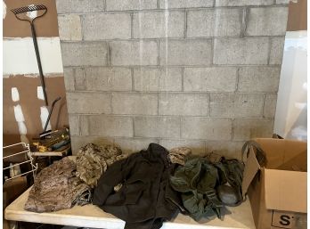 Large Group Of Modern Military Uniforms And Gear