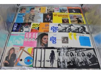 2 BINDERS OF 45 RPM RECORDS SLEEVES (mICK JAGGER, THE BEATLES)