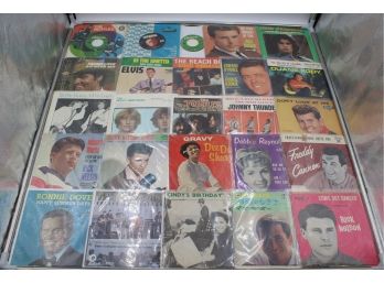 BINDER OF 45RPM RECORDS IN SLEEVES (THE BEATLES, ELVIS, THE BEACH BOYS)