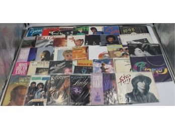 VINYL RECORDS 45RPM MISCELLANEOUS IN BINDER (TOM PETTY, KENNY ROGERS)