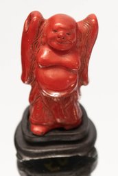 Chinese Carved Standing Cinnabar Buddha Raised On Circular Wood Stand