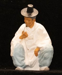 Signed Ceramic Squatting Chinese Man