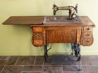 Damascus, Antique Foot Pedal Powered Sewing Machine With Tiger Oak Cabinet