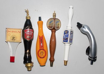 Assortment Of Beer Taps Including Old Stock Ale, London Pride And Weiss Hefeweizen