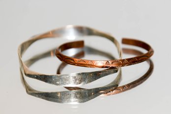 Two Bracelets, One Copper Cuff, And One Silver Tone Bangle