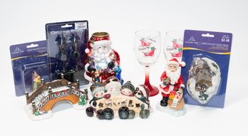 Lot Of Holiday Decor Including Village Accessories, Santa Tea Light And Christmas Wine Glasses