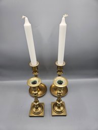 Two Pairs Of Brass Candlesticks