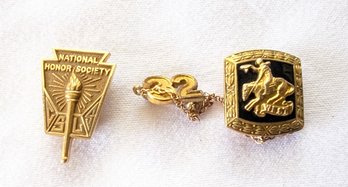 Two Stamped 14kt Yellow Gold Award Pins.