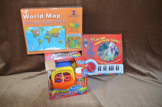 (#69) Children Toys:  World Map 500 Piece Jig Saw Puzzle, Musical Book, Bubble Generator Toy