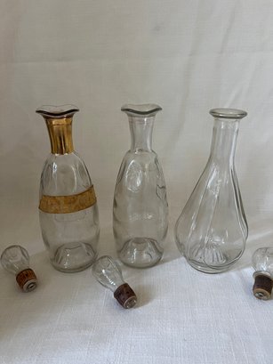 57) Set Of 3 Tall Empty Liquor Bottles With Stoppers 12'H
