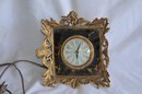 (#18) Vintage Brass Frame Clock Black / Gold Mirror Backing Electric - Not Tested - One Side Broke Off