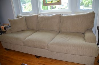 7) Beige Upholstered Sofa