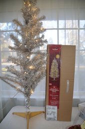 (#35) Artificial 4ft Pre-lit Clear Lights Silver Tinsel Tree - Works