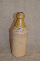 121) D. Luce Lemon Stoneware Beer Bottle 9.5'H