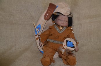 (#88) Porcelain Indian Doll With Felt Boat, Stamped Swan Collection  Approx. 8 X 11x  9