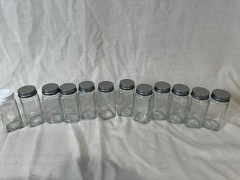 66) Set Of 12 Clear Glass Spice Jars With Silver Tops 4'H