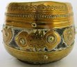 A Small Leather Bodied Bowl With Ornate Brass Overlay