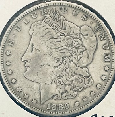 1889 MORGAN SILVER DOLLAR COIN - IN FLIP