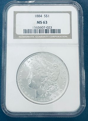 1884 MORGAN SILVER DOLLAR COIN - NGC GRADED MS 63 - CASE DAMAGED - SEE PICTURES