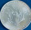 1986 US SILVER AMERICAN EAGLE - 1 0ZT 99.9 FINE SILVER DOLLAR COIN- TONED!