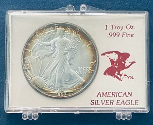 1987 AMERICAN SILVER EAGLE - 1 OZT .999 FINE SILVER ROUND COIN - TONED - IN DISPLAY CASE