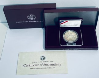 UNITED STATES MINT 1988 UNCIRCULATED SILVER DOLLAR OLYMPIC COIN - IN BOX, CASE & COA