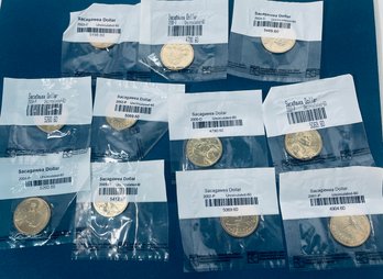 LOT (10) UNCIRCULATED SACAGAWEA ONE DOLLAR COINS- IN SEALED LITTLETON COIN PLASTIC