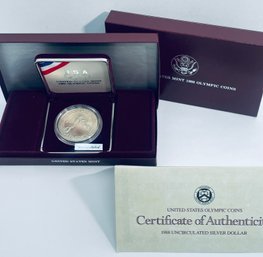 UNITED STATES MINT 1988 UNCIRCULATED SILVER DOLLAR OLYMPIC COIN - IN BOX & CASE W/ COA