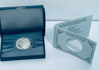 1982 UNCIRCULATED GEORGE WASHINGTON COMMEMORATIVE SILVER HALF DOLLAR COIN IN SEALED PLASTIC & BOX