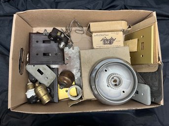 Box Of Assorted Electric Equipment Including Outlets, Light Switches, And Lamp Parts