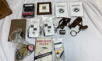Assorted Hunting And Fishing Tools And Books