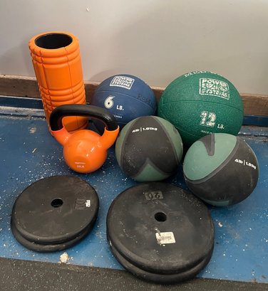 Collection Of Medicine Balls And Workout Items