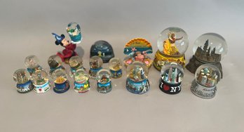 Collection Of Souvenir Snow Globes From Cites And Places Around The World